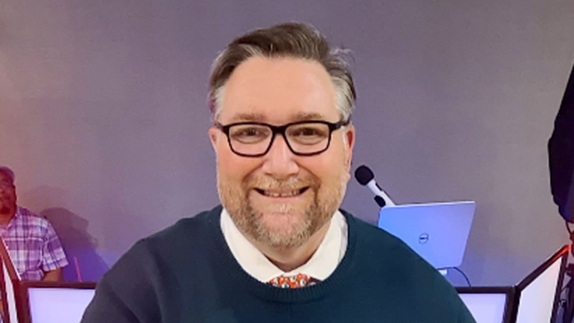 A Healthy Connections Employee, Slatton, staring and smiling at the camera.