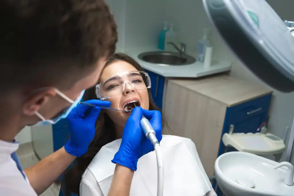 A girl having a preventive treatment done on her teeth.